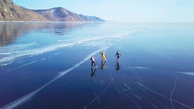 Tourists on the ice from aerial view. Winter in Siberia, Baikal Lake.