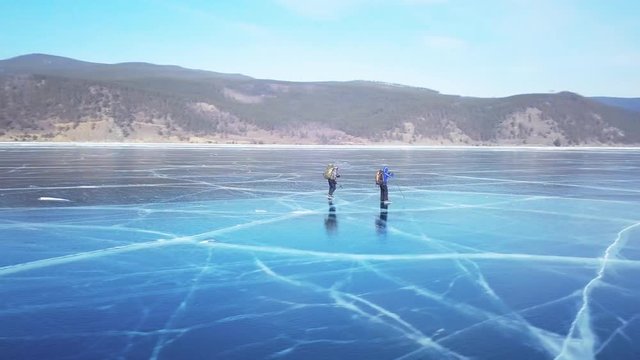 Tourists on the ice from aerial view. Winter in Siberia, Baikal Lake.