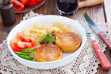 Chickpea cutlets with vegetables and pasta, selective focus
