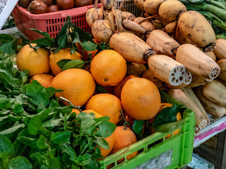 lotus root, orange and vegetable at market in Hong Kong