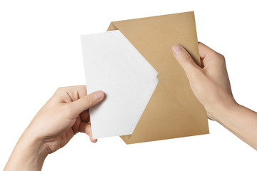 Hands pulling a blank paper out of a brown envelope, isolated on white background
