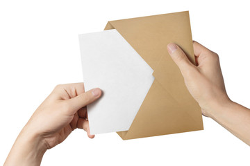 Obraz premium Hands pulling a blank paper out of a brown envelope, isolated on white background