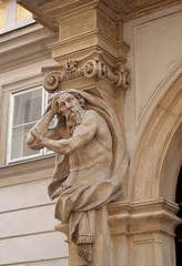 Detail from an Atlas or Atlante, a male figure used for support in a building, on a doorway in Vienna's old town