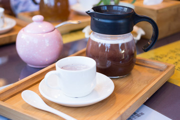 hot dark milk chocolate cup with teapot