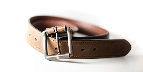 Close up of worn belt with white background