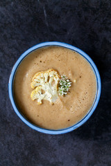 Cauliflower soup with wild garlic flowers