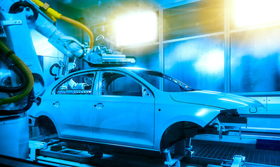 Naklejka premium In the automobile manufacturing and manufacturing plant, the car frame is being painted.