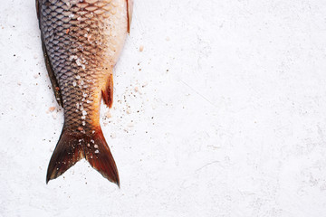 Raw freshwater carp with salt and pepper