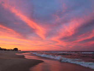 Fototapeta na wymiar Amazing orange, pink, red, and purple sunset along the beach in the outer banks of North Carolina