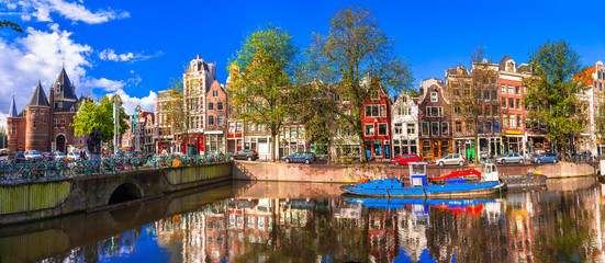 Romantic canalas of Amsterdam. Travel in Holland - obrazy, fototapety, plakaty