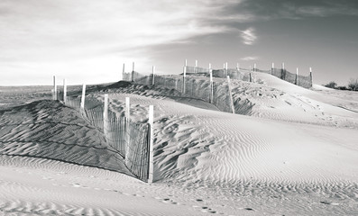 Fences along the rise of sand dunes in the outer banks of North Carolina