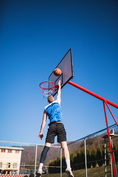 Basketball player slam dunk