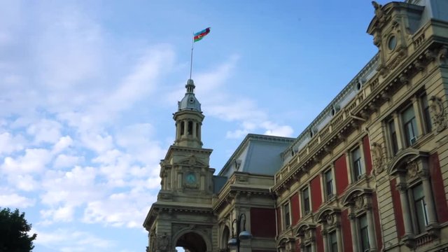 Old building with Azerbaijan flag in the centre of Baku city