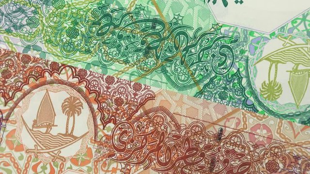 Qatar riyal notes slow rotating. Qatari currency, money. 4K stock video footage