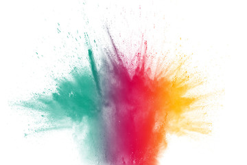 Multicolored powder explosion on white background.Launched colorful particles on background.