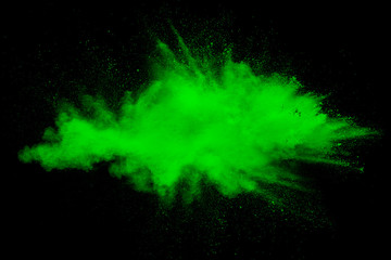 Green color powder explosion cloud on white background. Green dust splash.