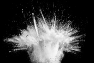 Abstract white powder explosion against black background.White dust exhale in the air.