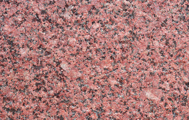 Red granite wall with quarts as background