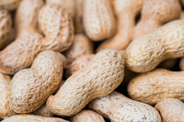 Close up unpeeled peanuts for background image