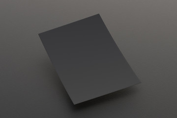 Blank black paper sheet flying over background