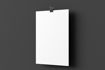 Blank paper poster hanging on binder clip