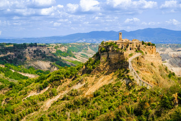 Fototapeta na wymiar Civita di Bagnoregio, panoramic view of the dying city on a rock, and the canyon around the mountain.