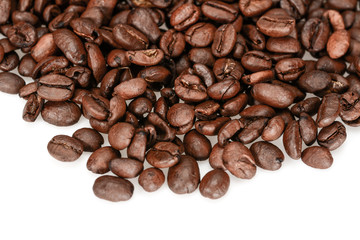 Hard roasted coffee beans, dark brown close up isolated on a white background