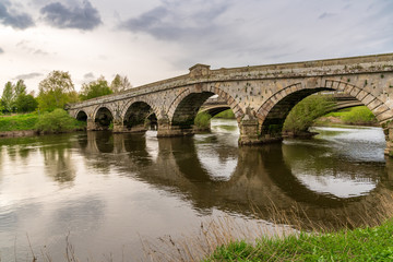 Fototapeta na wymiar Atcham Bridge over the River Severn in Atcham, near Shrewsbury, Shropshire, England, UK
