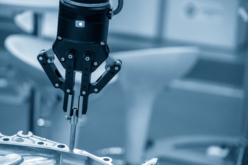 The robotic arm use in  assembly production line .The hi-technology electronic parts manufacturing process  in industrial 4.0 concept.
