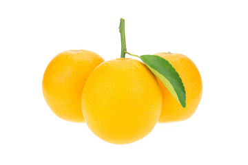 Orange juice and oranges with leaves