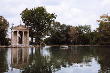 Fototapeta na wymiar Panoramic view of Temple of Asclepius (Tempio di Esculapio) and lake