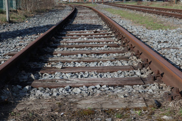 rundown rail track with wooden sleepers