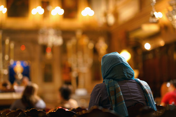 A believer prays in the church of Saint Spiridon in Corfu