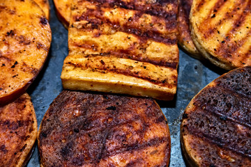 Various sorts of grilled cheese fresh from the grill
