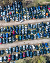 Obraz premium Lines of crushed cars wreck in scrapyard before being shredded recyling