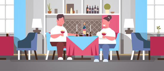 fat overweight couple drinking wine sitting cafe table over size obese man woman romantic love dating concept modern restaurant interior flat horizontal