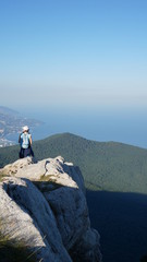 man on top of mountain