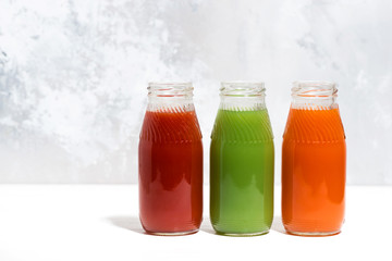 colorful vegetable juices in bottles