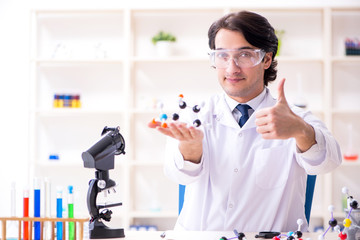 Young male scientist working in the lab 