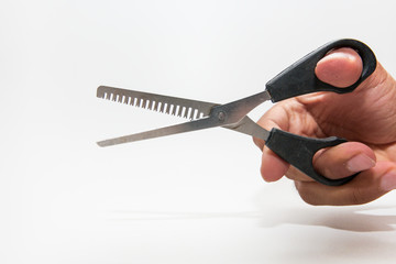 Scissors haircut in hand on white background