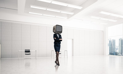 Fototapeta na wymiar Business woman with an old TV instead of head.
