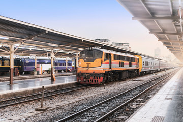 Fototapeta premium vintage train parking on train tracks at railway station