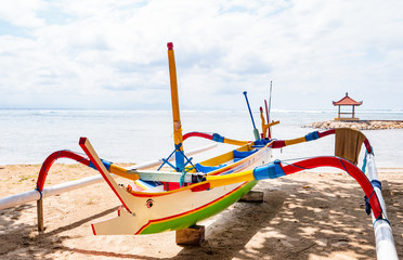 Colorful traditional wooden boat on a beach in Bali