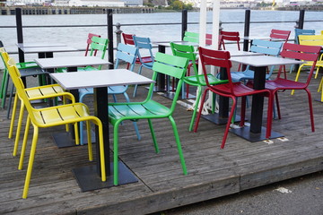 colorful empty tables and chairs