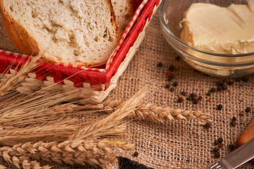 Organic Whole wheat lying on bread on black background with copy space. Selective focus