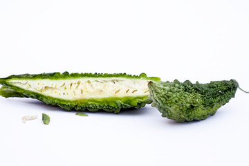 Raw organic bitter melon or Bitter Cucumber or Bitter Gourd isolated on white.