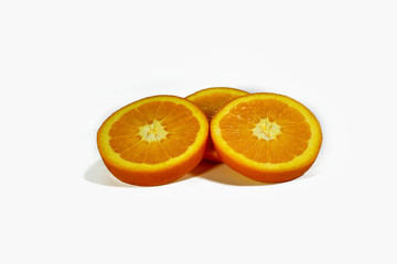 Fototapeta na wymiar Sliced orange slices, stacked isolated on a white background