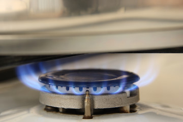 Blue fire gas burner under the pan