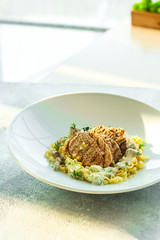 roast meat, pasta fine Annellini and creamy sauce (main dish). food background. top view