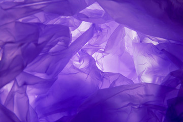 Plastic bag background. Violet texture. Purple background r texture. For design templates, as a canvas for text, advertising.